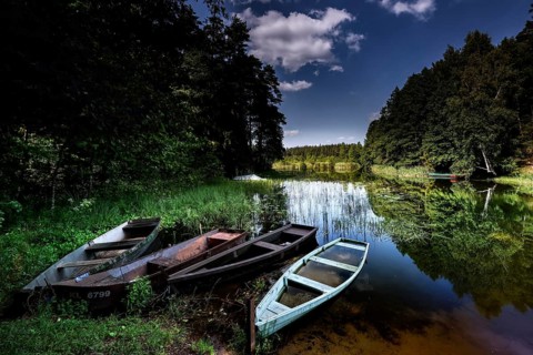 Three boats on quiet lakeside in Zemaitija National Park