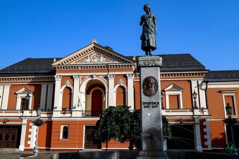 Historic theatre on Theatre Square with the Angel of Tharau statue in the old town, Klaipeda,