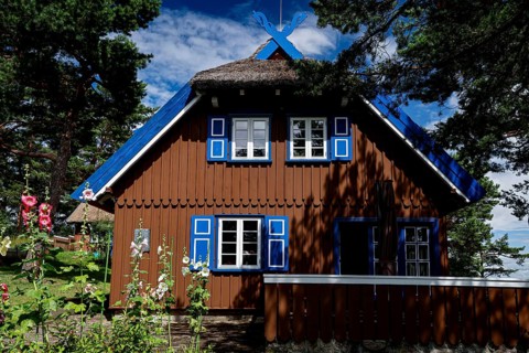 The Thomas Mann house in Niden with blue shutters under a blue sky, Nidden, Lithuania
