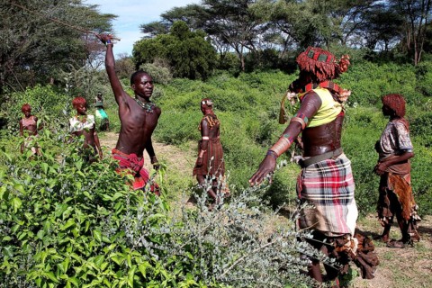 Hamer woman in a traditional initiation scene, with a focus on a flogging, Turmi, Ethiopia
