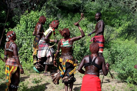 Hamer woman take part in a whipping ritual to show strength, Turmi, Ethiopia