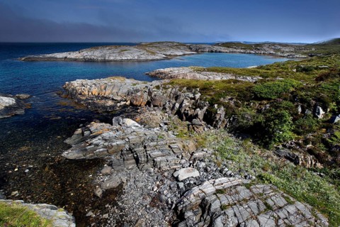 Rugged rocky coast with views from Eldhusøya across the sea near Lyngholmen, Atlanterhavsveien,