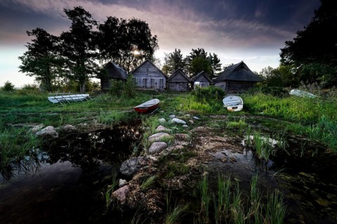 Fishing sheds and boats on the quiet beach of Altja at dusk, Altja, Estonia