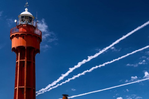 Red lighthouse of Ristna against a clear blue sky, Hiiumaa, Ristna, Estonia