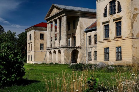 Historic building with decorated facades surrounded by nature in the Kolga manor house, Kolga,