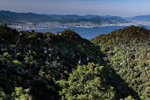 View of the forests and coastal landscape from Mount Misen with a view of Hiroshima, Miyajima,