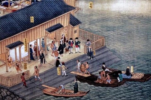Scenic depiction of the hustle and bustle on the water in front of a Dutch trade base on Dejima,