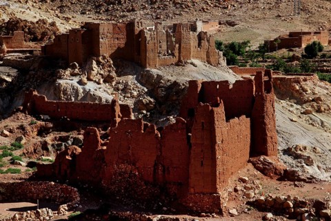 Red sandstone ruins in a desert-like landscape in the Ounilla Valley
