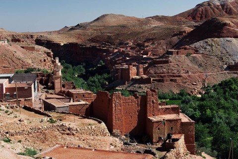 Historic red sandstone buildings nestled in the green Ounilla Valley