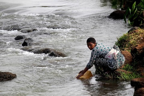 Woman fetching water from the river in the Nile Valley near Tisissat, Tisissat, Nile Valley,