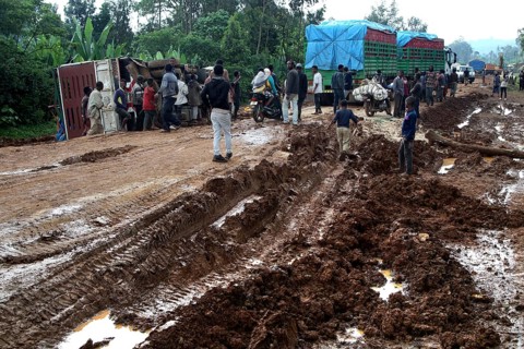 Poor road conditions with trucks waiting and people in the mud, Yirga Alem route, Yabello, Ethiopia
