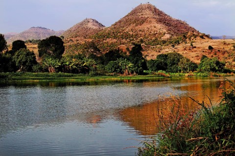 River with mountains in the background and trees on the banks of the Nile Valley, Tisissat, Nile