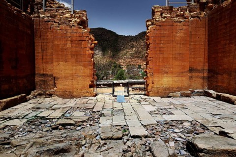 Ruins inside the Great Temple of Yeha with views of the surrounding landscape