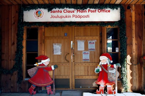 Santa Claus Village Post Office wooden building with festive Santa Claus decoration, Napapiiri,