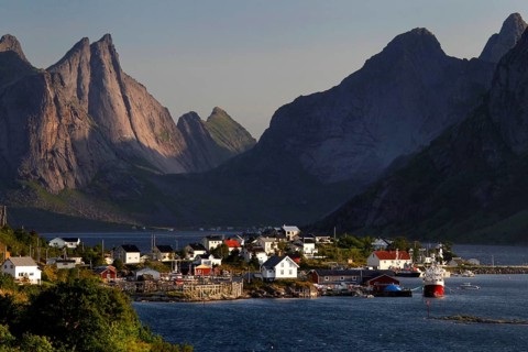 Hamnøay village with a view of the sea and distinctive mountain scenery of Lofoten, Hamnøay,
