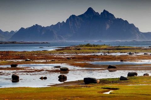 Wide coastal landscape with mountain views near Vestvågøy