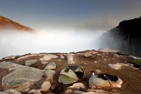 Single tent in fog on a rocky plateau near Kjeragbolten, Lysefjord, Rogaland, Norway