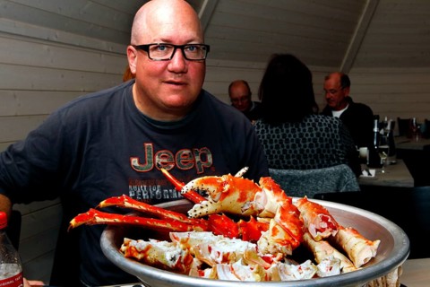 Person sitting in front of a large plate of king crab in Sarnes, Sarnes, Norway