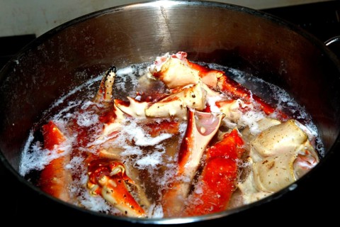 King crab legs cooking in a large pot in Sarnes, Sarnes, Norway