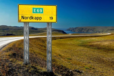 Road sign to the North Cape on the E69 in front of a vast landscape, Nordkapp, Magerøya, Norway