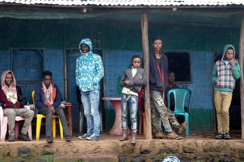 People in front of simple building in Rira, Bale Mountains, cool atmosphere, Rira, Bale Mountains,