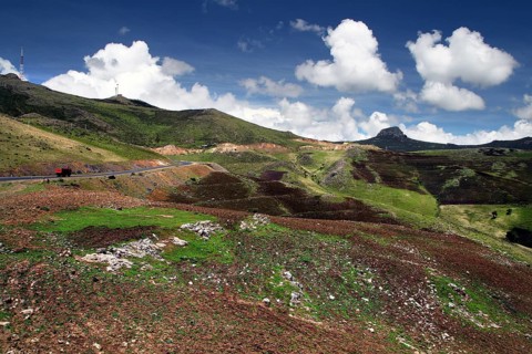 Extensive mountain landscape under blue sky with clouds in Bale Mountains National Park, Bale