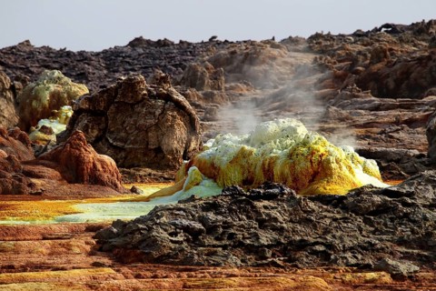 Vivid geothermal scene in Dallol with steaming sulfur-rich formations, Dallol, Afar region,