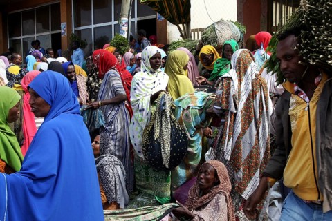 People wearing colorful clothes at a market, hustle and bustle, Awaday, Ethiopia