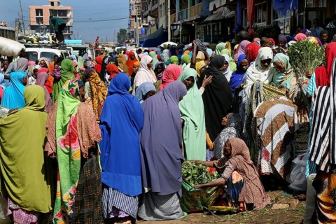 Busy market with people wearing colorful clothes, Khat trade, Awaday, Ethiopia