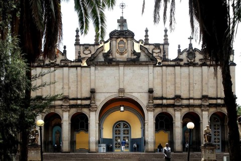 Impressive façade of the Trinity Church in Addis Ababa, framed by palm trees, Addis Ababa, null,