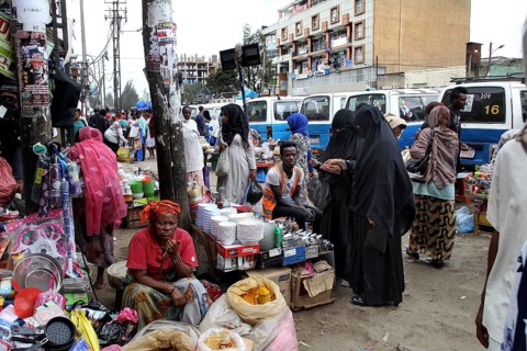 Grocery store on a busy street with woman wearing hijab, Addis Ababa, Mercato, Ethiopia