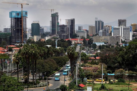 Modern skyline with skyscrapers and cranes surrounded by vegetation, Addis Ababa, Ethiopia