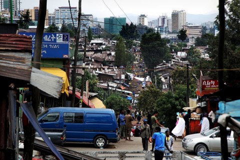 Busy street view in the Mercato of Addis Ababa with people and vehicles, Addis Ababa, Ethiopia