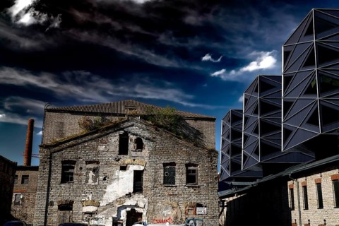 Contrast between historic and modern architecture in the Rotermann quarter, gloomy sky, Tallinn,