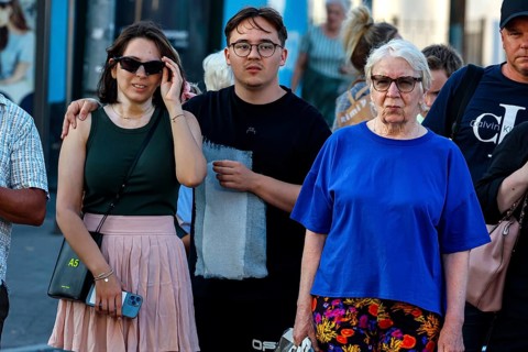 Three people wearing casual clothes in an urban environment in Tallinn, Tallinn, South Alinn,