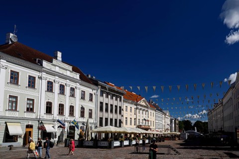 Panorama of buildings along Town Hall Square, Rathausplatz, Rathausplatz in Tartu under a bright