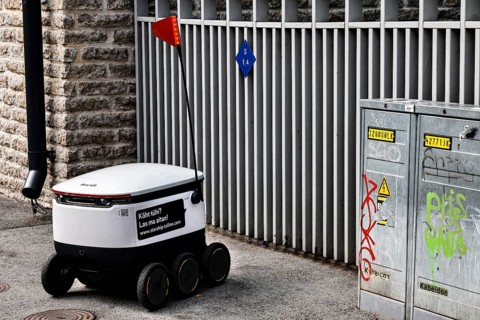 Small delivery robot on a paved road in Tallinn, Tallinn, Kelmiküla, Estonia