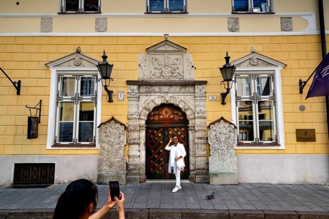 The magnificent façade of the Guild House in the Old Town attracts tourists with its architecture,