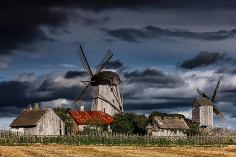 Traditional windmills against dramatic skies in Angla, Angla, Saaremaa, Estonia