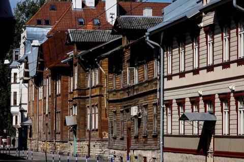 Row of historic wooden houses in Kelmiküla with decorated facades, Tallinn, Harju, Estonia