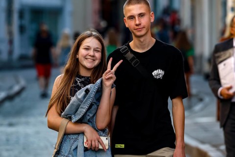 A young couple walking through the old town smiling and enjoying the day, Tallinn, Harju, Estonia