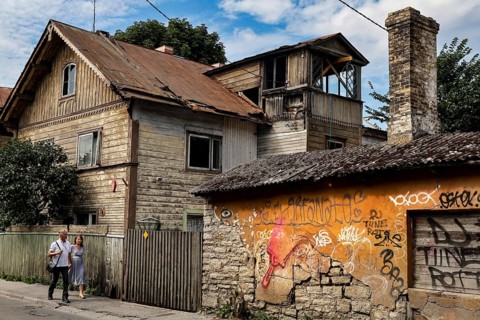 Various wooden houses decorated with graffiti in Kelmiküla Tallinn, Tallinn, Harju, Estonia