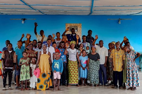 Large group at the outpatient ward for the mentally ill, showing community and support, Mbahiakro,