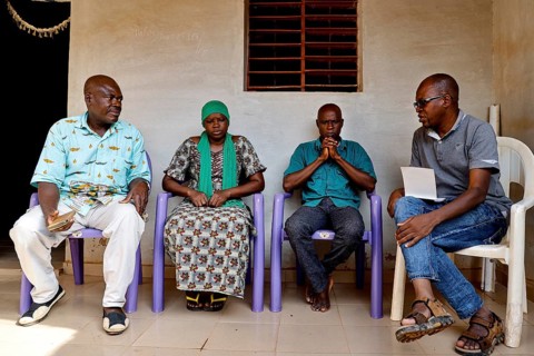 CJK members and patients having an intensive discussion at home, Korhogo, CI, West Africa