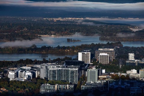 View of Canberra CBD from Mount Ainslie Lookout in the morning with fog fields over the lake,
