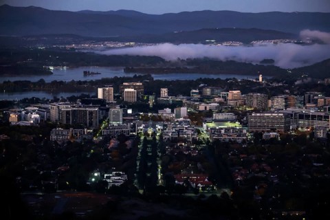 Nighttime view from Mount Ainslie Lookout of Canberra's illuminated CBD at dusk, Canberra,