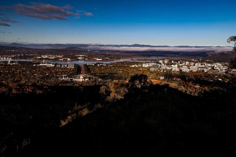 Panoramic view of Canberra from Mount Ainslie Lookout, framed by wide sky and clouds, Canberra,