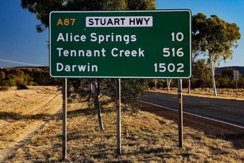 Sign showing distances to Alice Springs and Darwin on Stuart Hwy, Alice Springs, Australia