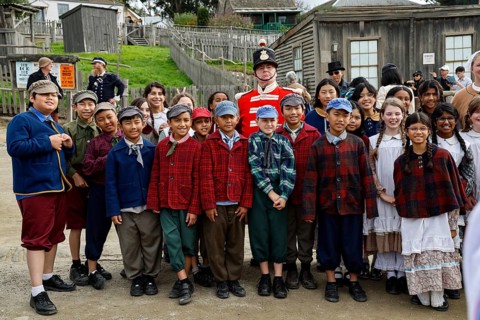 Group of children in period costumes with a soldier in Sovereign Hill, Ballarat, Ballarat,