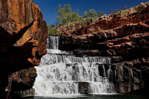 Impressive waterfall in Bell Gorge that flows over several rock steps, Bell Gorge, Australia